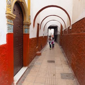 Rabat-Medina---kids-covering-their-faces-on-a-narrow-street